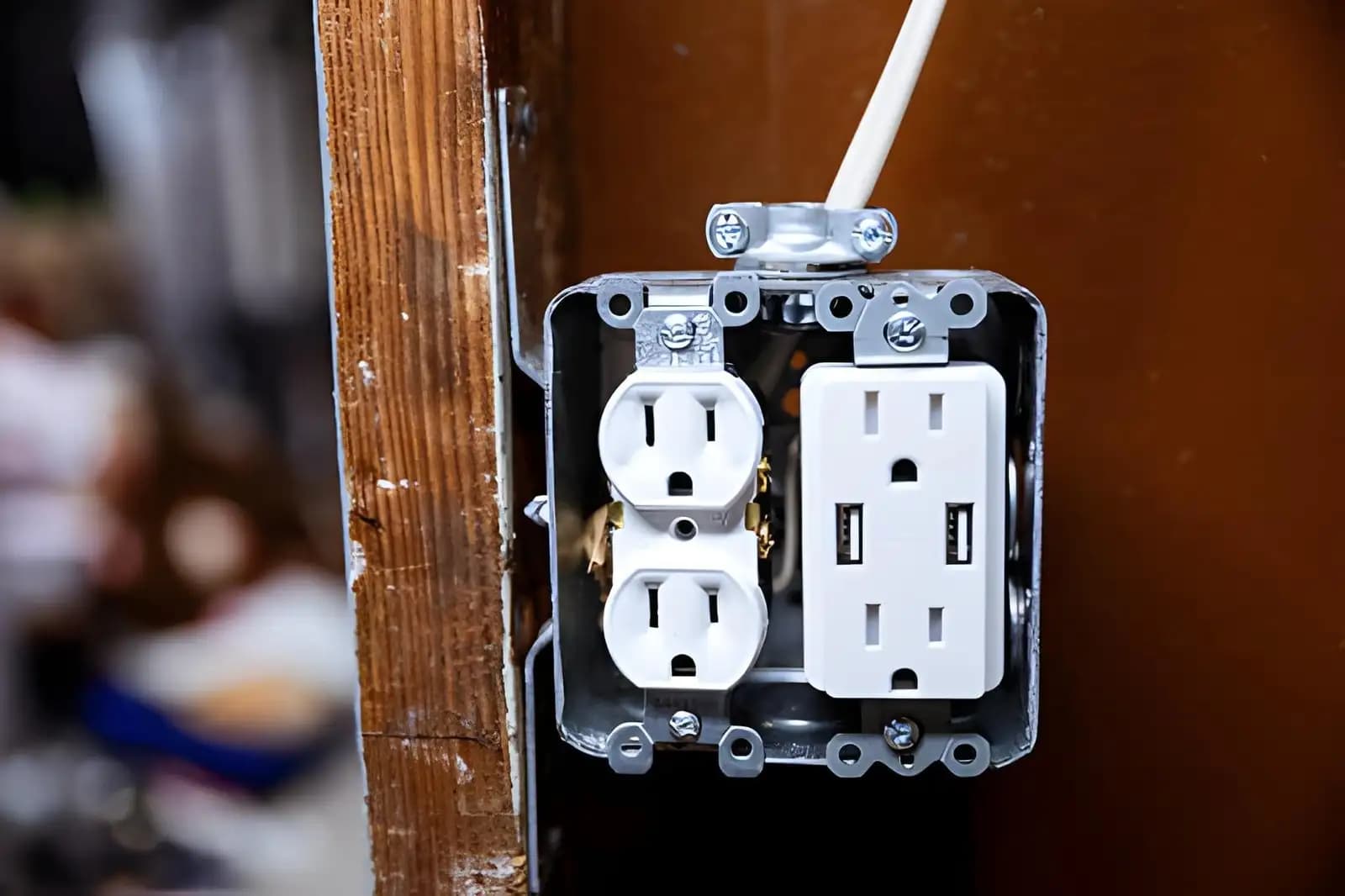 New electrical outlet with built-in USB ports installed in a wall